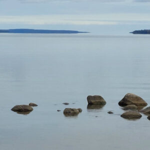 photo of colpoy's bay with rocks in the foreground